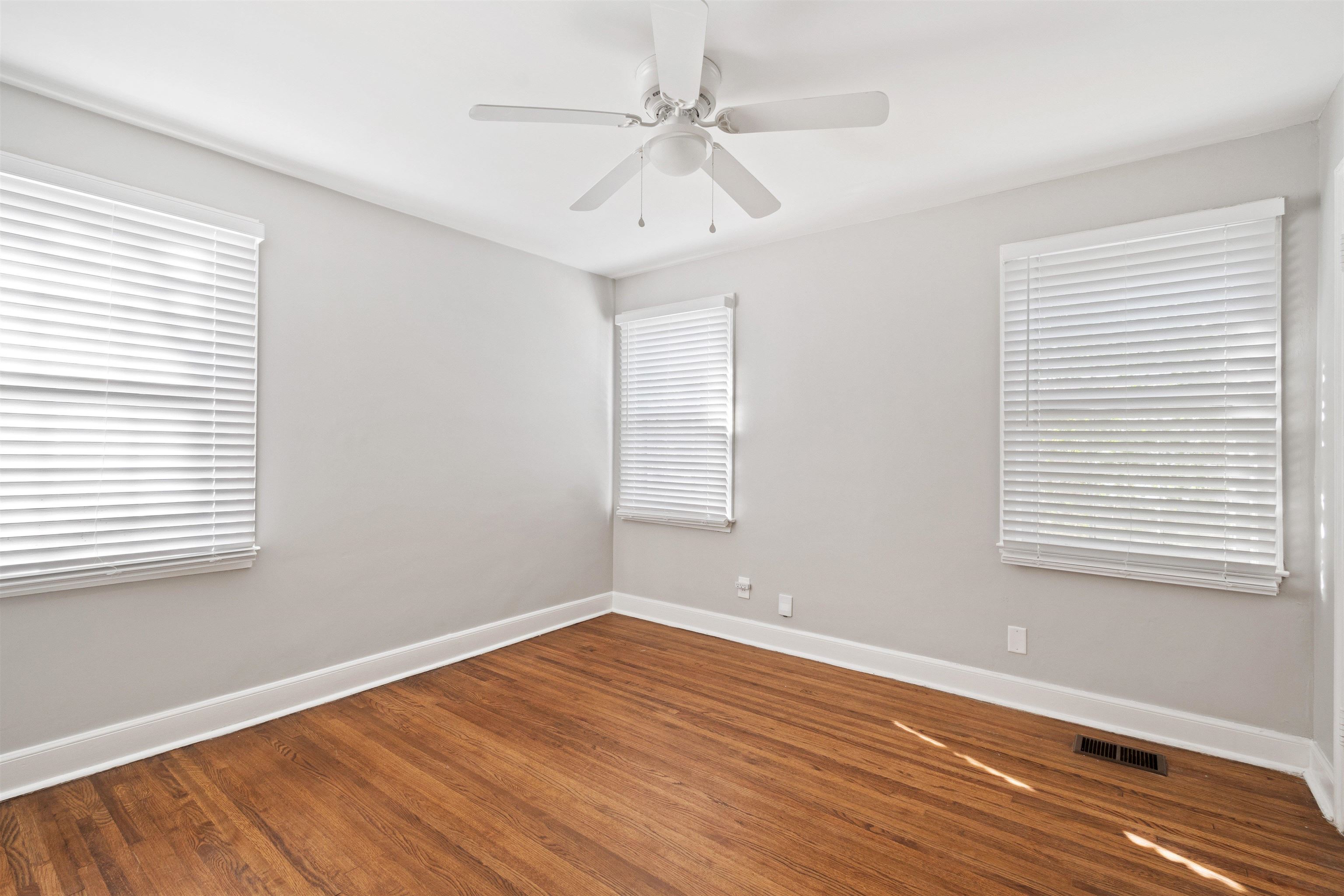 3753 Friar Tuck Road Memphis, TN 38111 - Photo 17 of 23 wooden floor in an empty room with a window