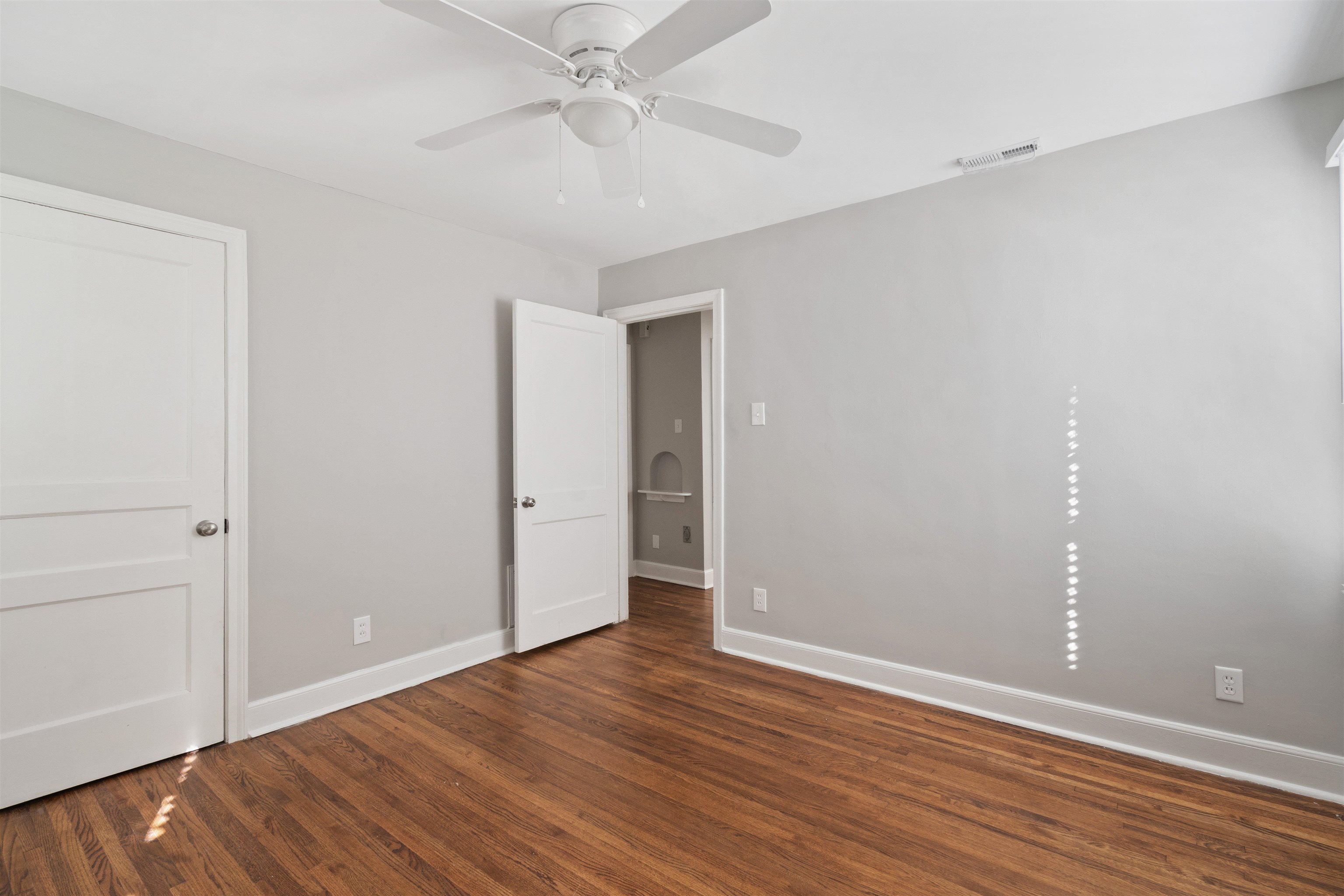 3753 Friar Tuck Road Memphis, TN 38111 - Photo 18 of 23 a view of an empty room with wooden floor