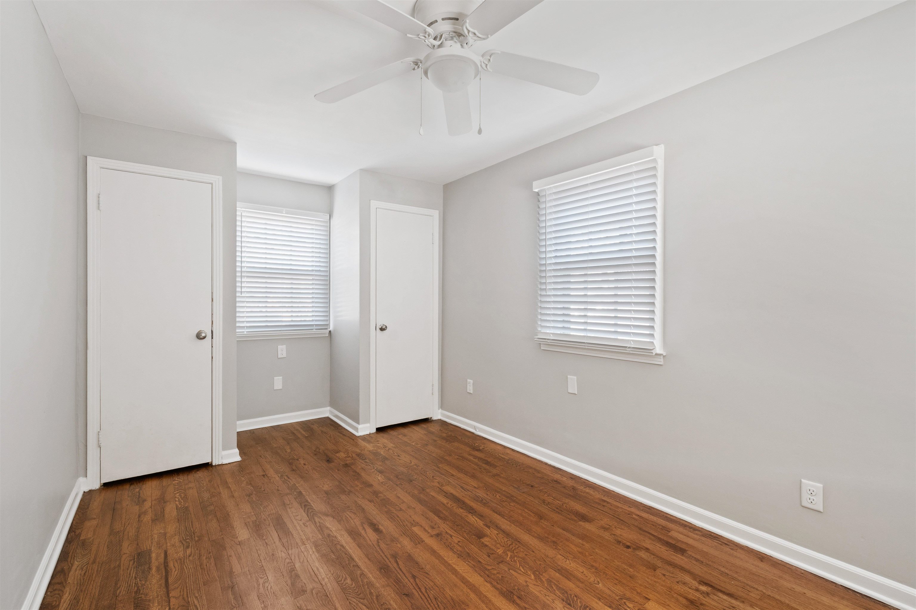3753 Friar Tuck Road Memphis, TN 38111 - Photo 19 of 23 wooden floor in an empty room with a window