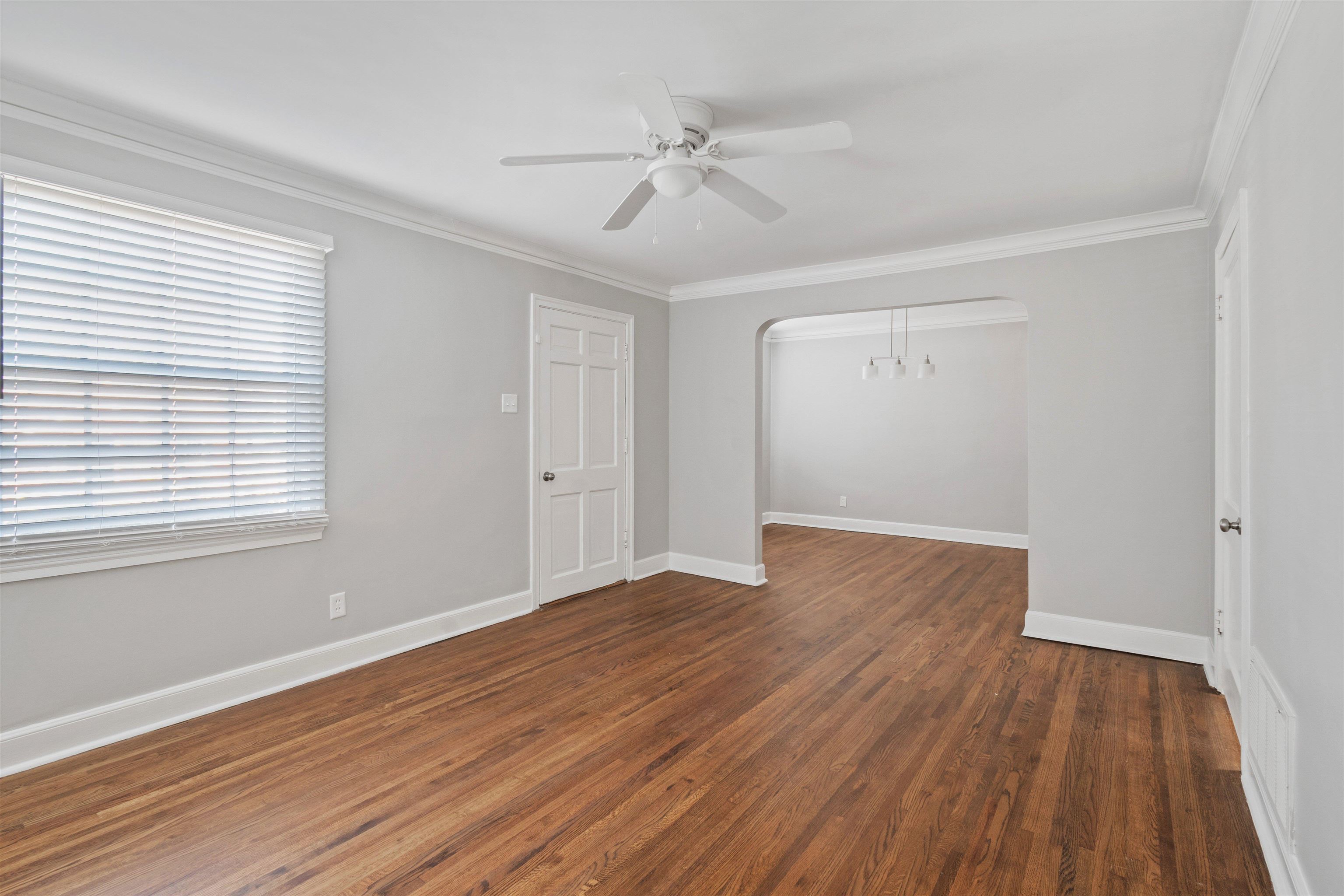 3753 Friar Tuck Road Memphis, TN 38111 - Photo 6 of 23 a view of an empty room with wooden floor and a window