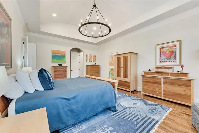 a spacious bathroom with a granite countertop sink a mirror and shower