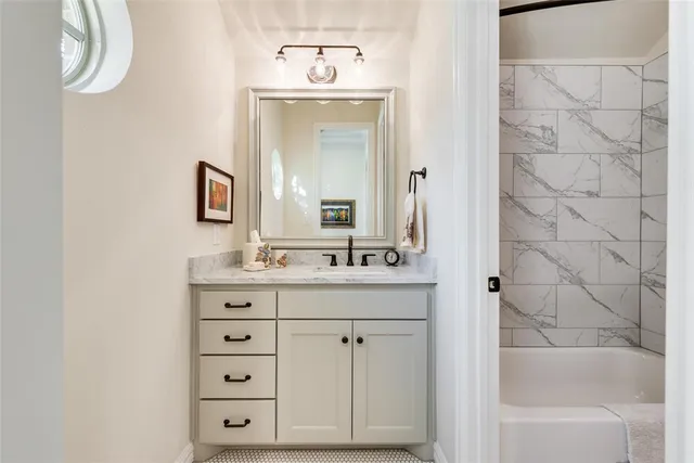 a livingroom with a bookshelf and a workspace