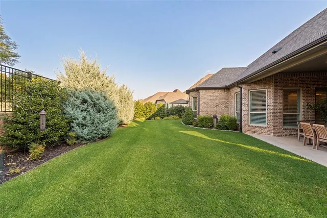 a front view of a house with a yard and porch