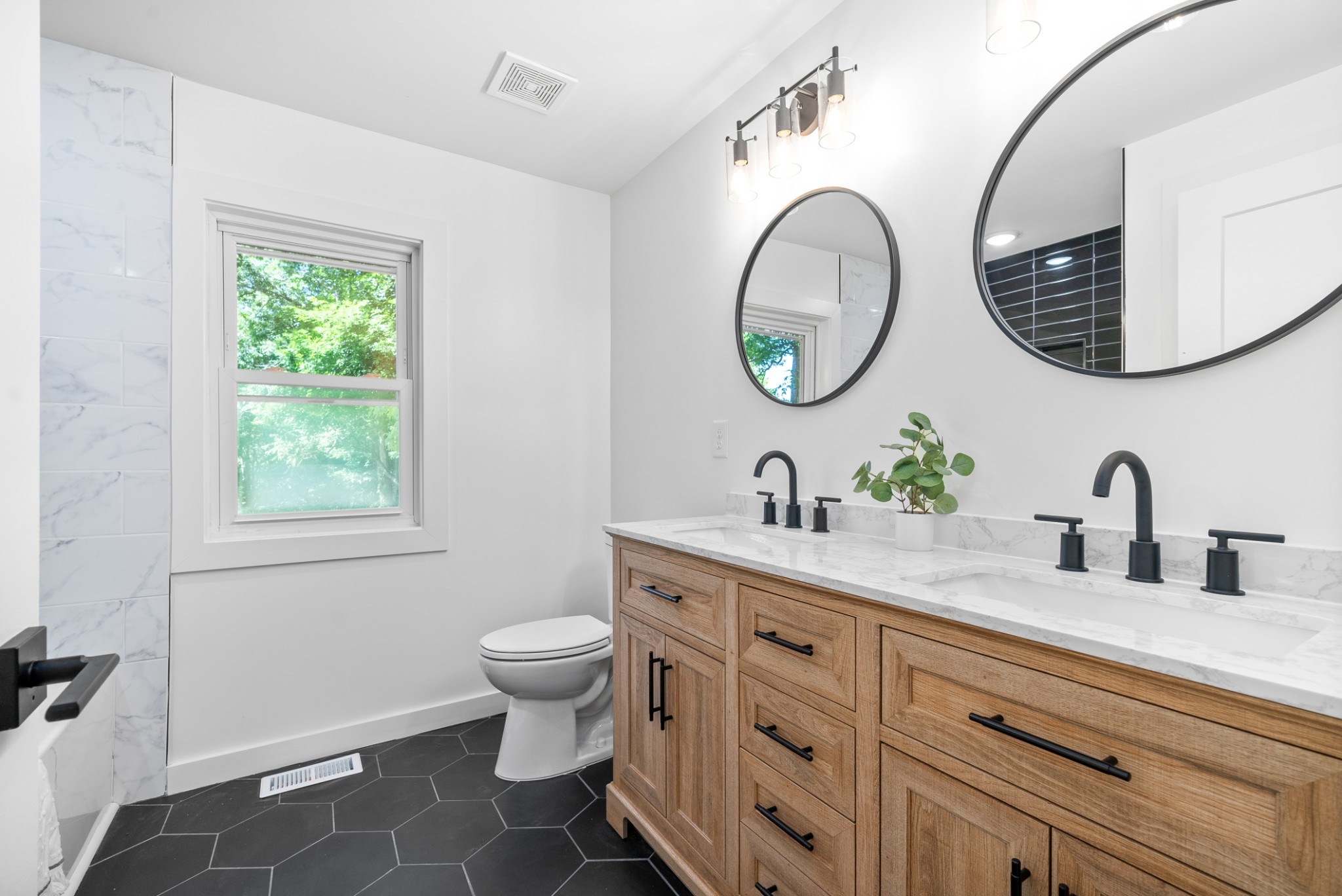 1120 Kingston Springs Road Kingston Springs, TN 37082 - Photo 15 of 20 a bathroom with a granite countertop toilet a sink and a mirror