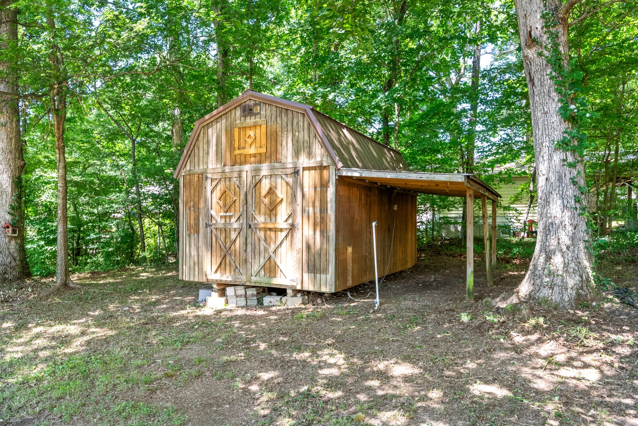 1120 Kingston Springs Road Kingston Springs, TN 37082 - Photo 19 of 20 a view of a tiny house with large trees