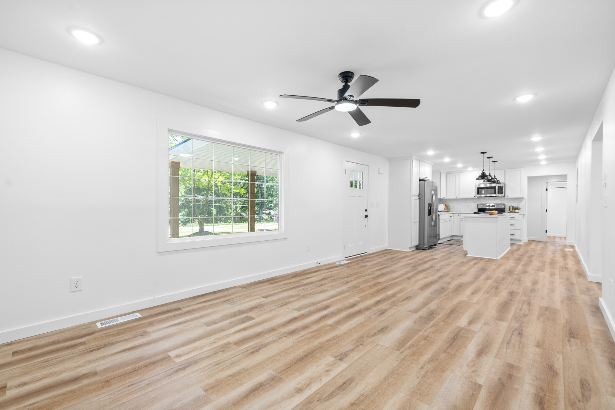 1120 Kingston Springs Road Kingston Springs, TN 37082 - Photo 5 of 20 a view of a bedroom with a bed and a window