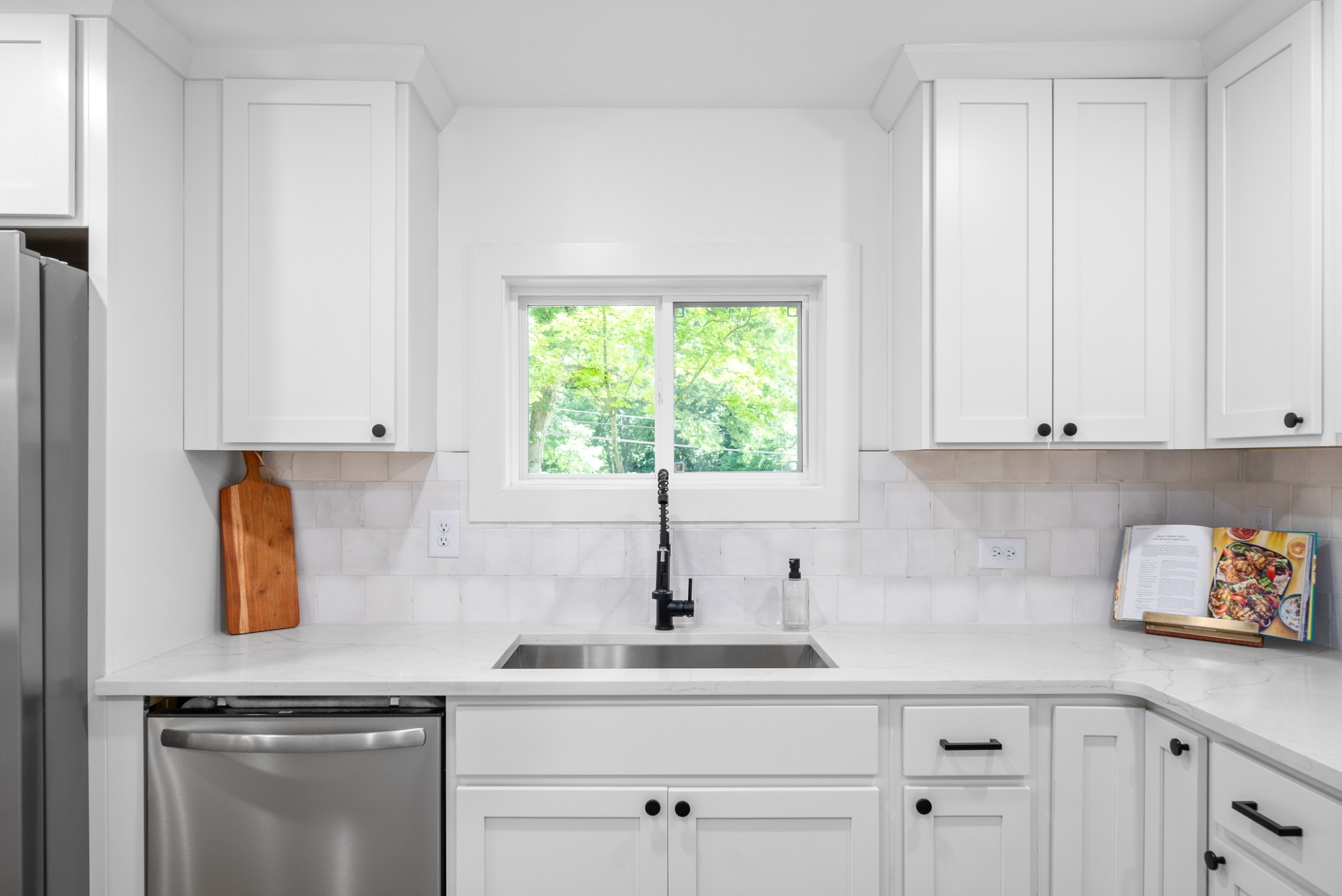 1120 Kingston Springs Road Kingston Springs, TN 37082 - Photo 7 of 20 a kitchen with white cabinets and a window