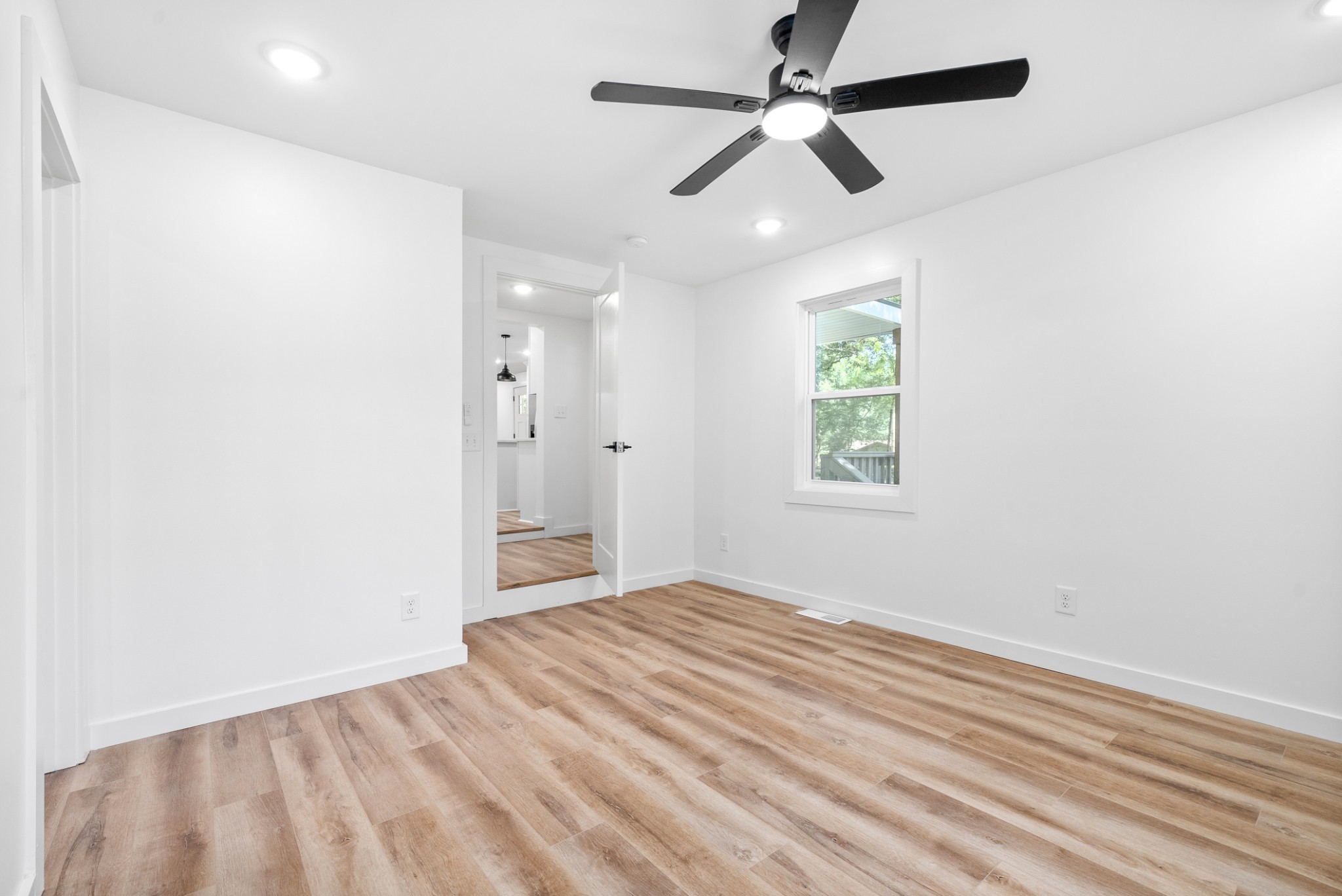 1120 Kingston Springs Road Kingston Springs, TN 37082 - Photo 10 of 20 an empty room with fan and windows