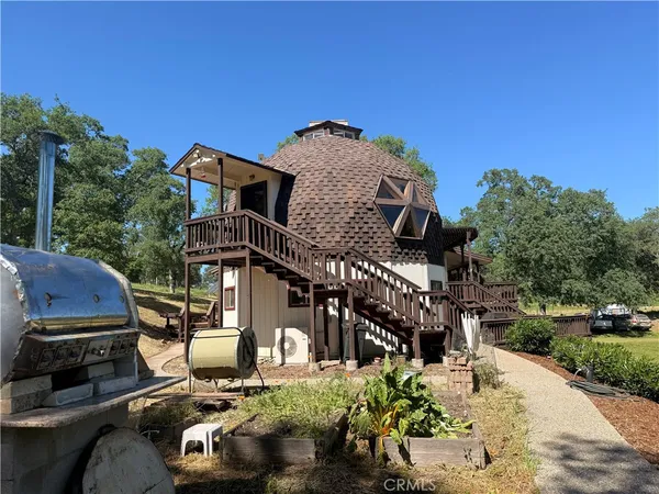 a view of a wooden door with a yard