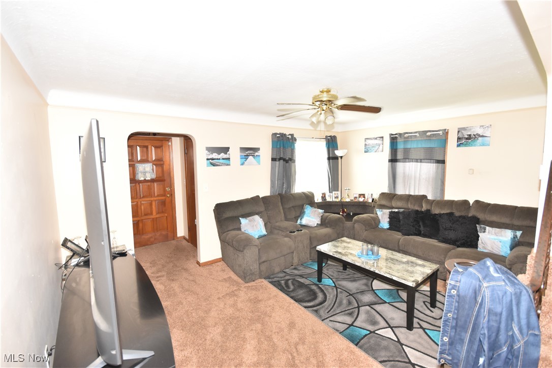 5840 Turney Road Cleveland, OH 44125 - Photo 2 of 21 Living room with light carpet and ceiling fan