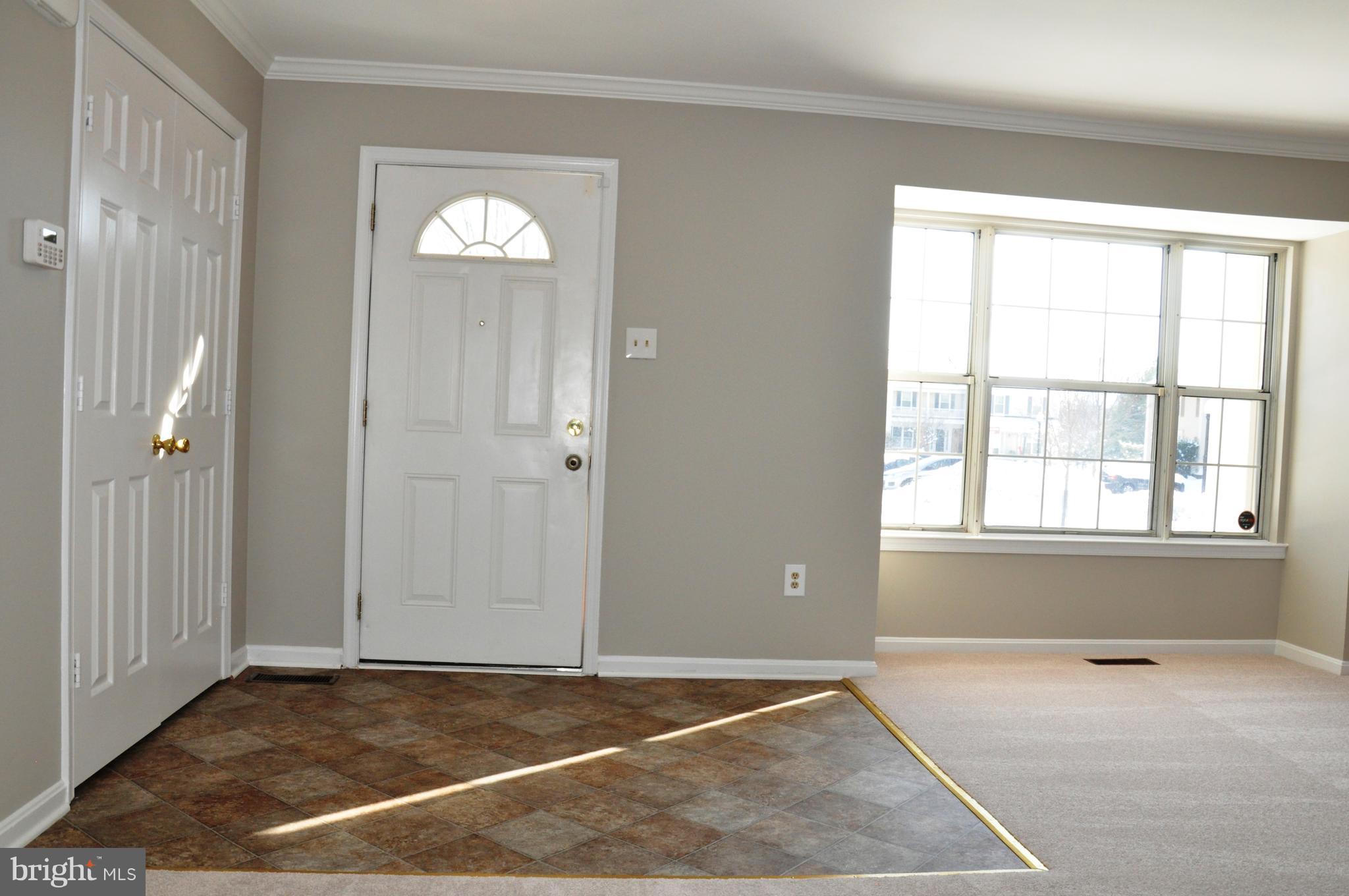 15122 Callohan Court Silver Spring, MD 20906 - Photo 2 of 29 Gracious foyer with new flooring and big windows.