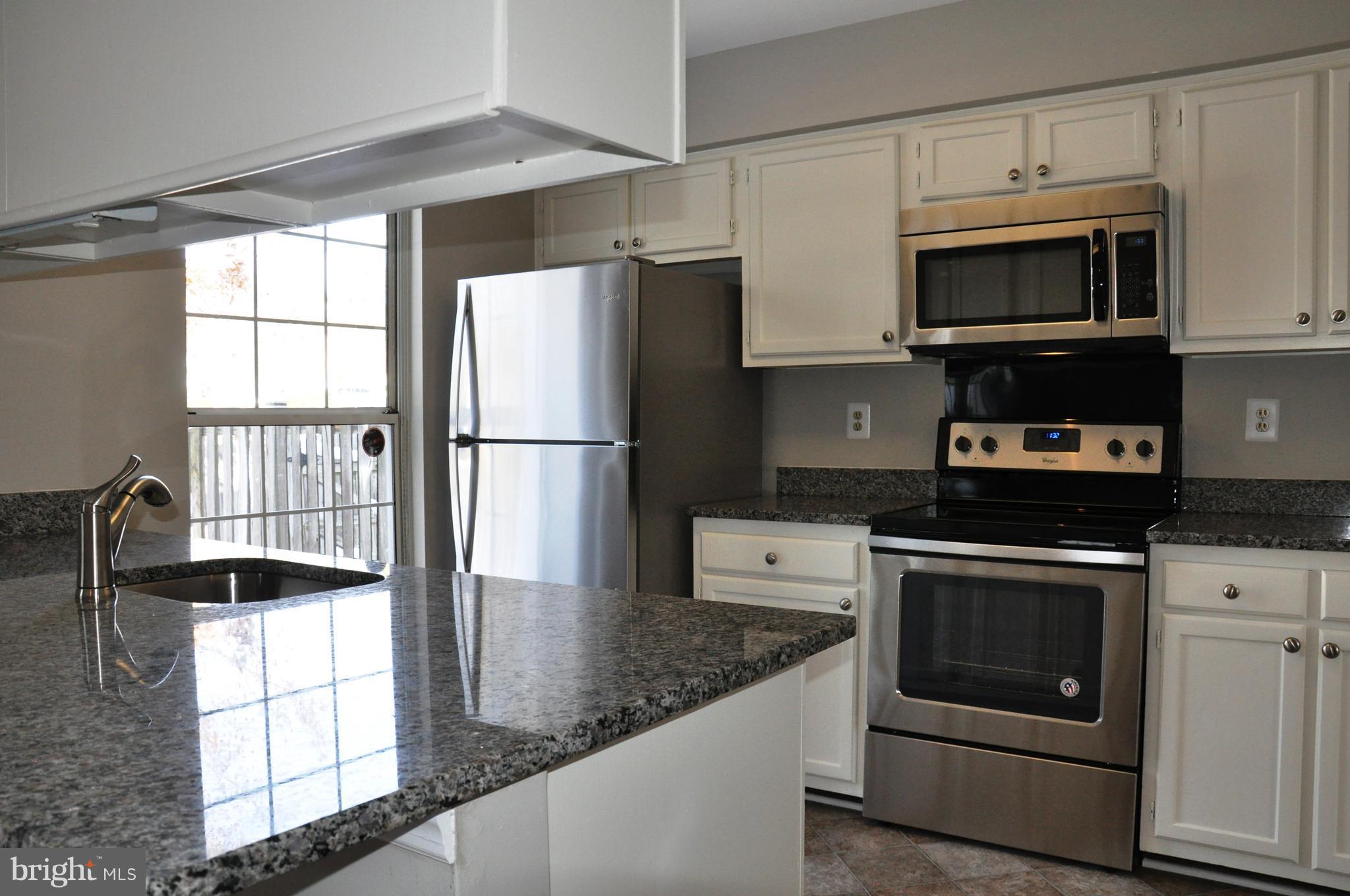 15122 Callohan Court Silver Spring, MD 20906 - Photo 11 of 29 Brand new appliances granite + flooring in kitchen