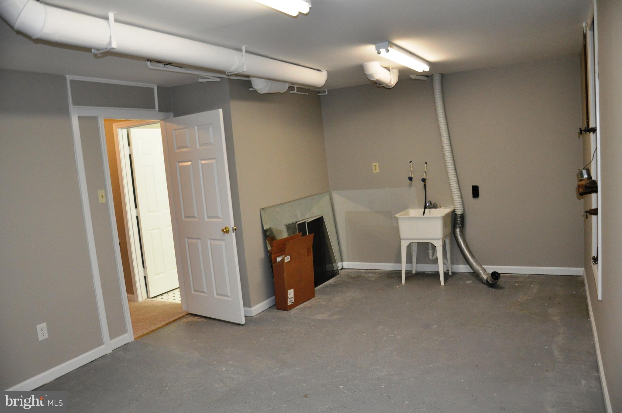 15122 Callohan Court Silver Spring, MD 20906 - Photo 25 of 29 Very large finished storage and laundry room.