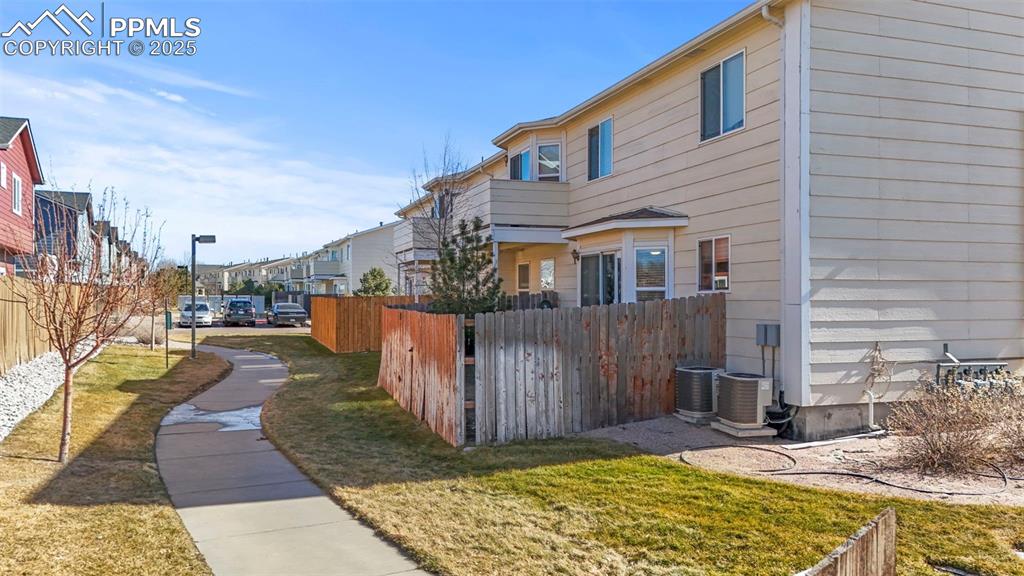 4806 Rusty Nail Point, Unit 101 Colorado Springs, CO 80916 - Photo 36 of 39 a view of a house with wooden fence
