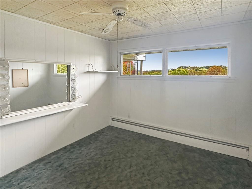 346 North Eighty Eight Road Carmichaels, PA 15320 - Photo 11 of 13 an empty room with windows and fan