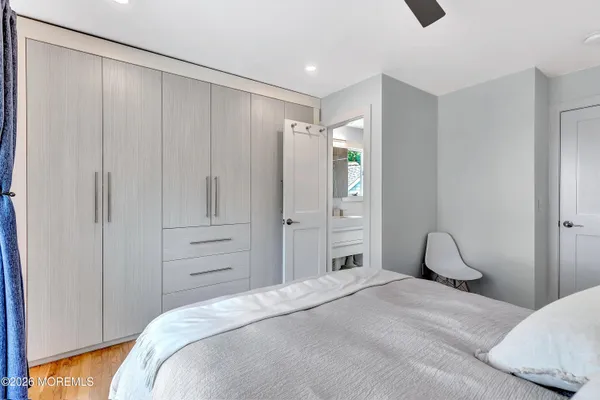 a bedroom with a bed and a closet