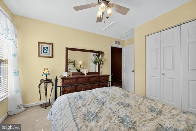 a bedroom with a bed and a dresser