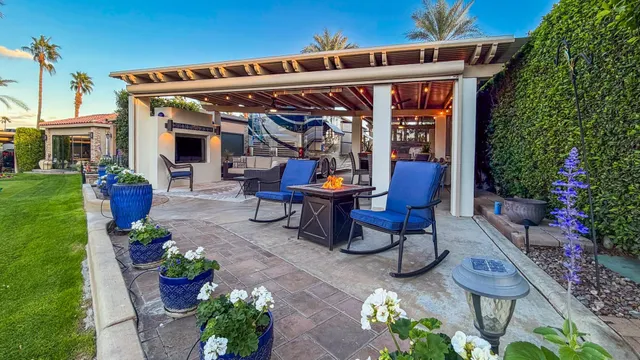 a view of a chairs and table in a patio