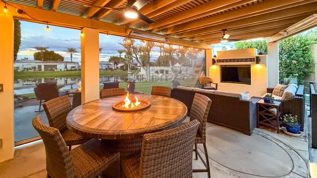 a outdoor dining space with furniture and garden view