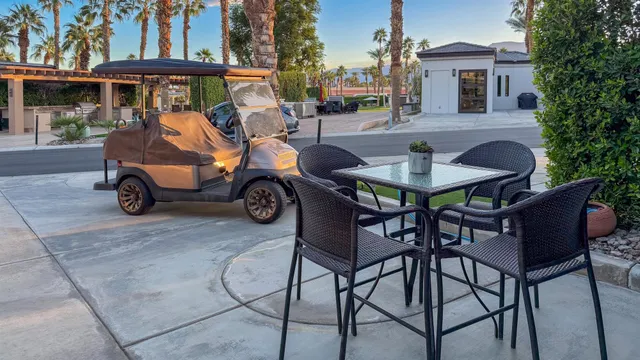 a wooden bench sitting in front of a building