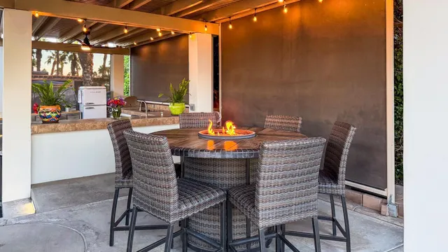 a dining room with furniture and a window