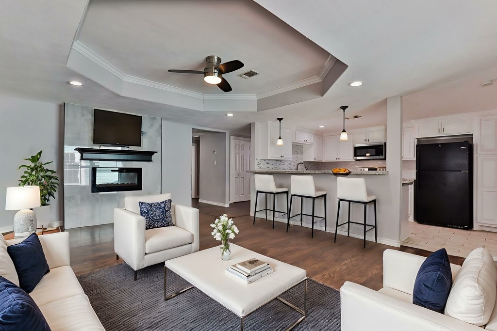 218 3 Rd Street Brazoria, TX 77422 - Photo 6 of 19 a living room with furniture kitchen view and a flat screen tv