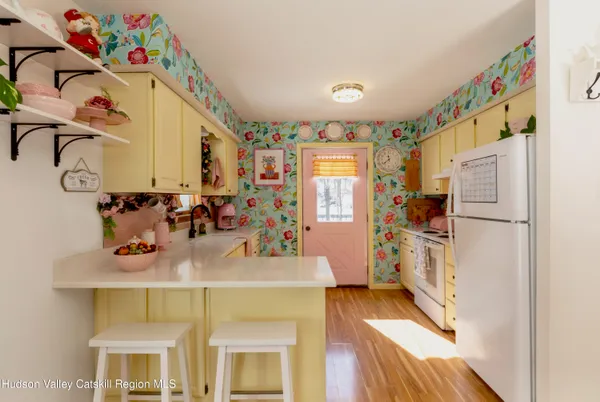 a kitchen with stainless steel appliances granite countertop a sink and cabinets