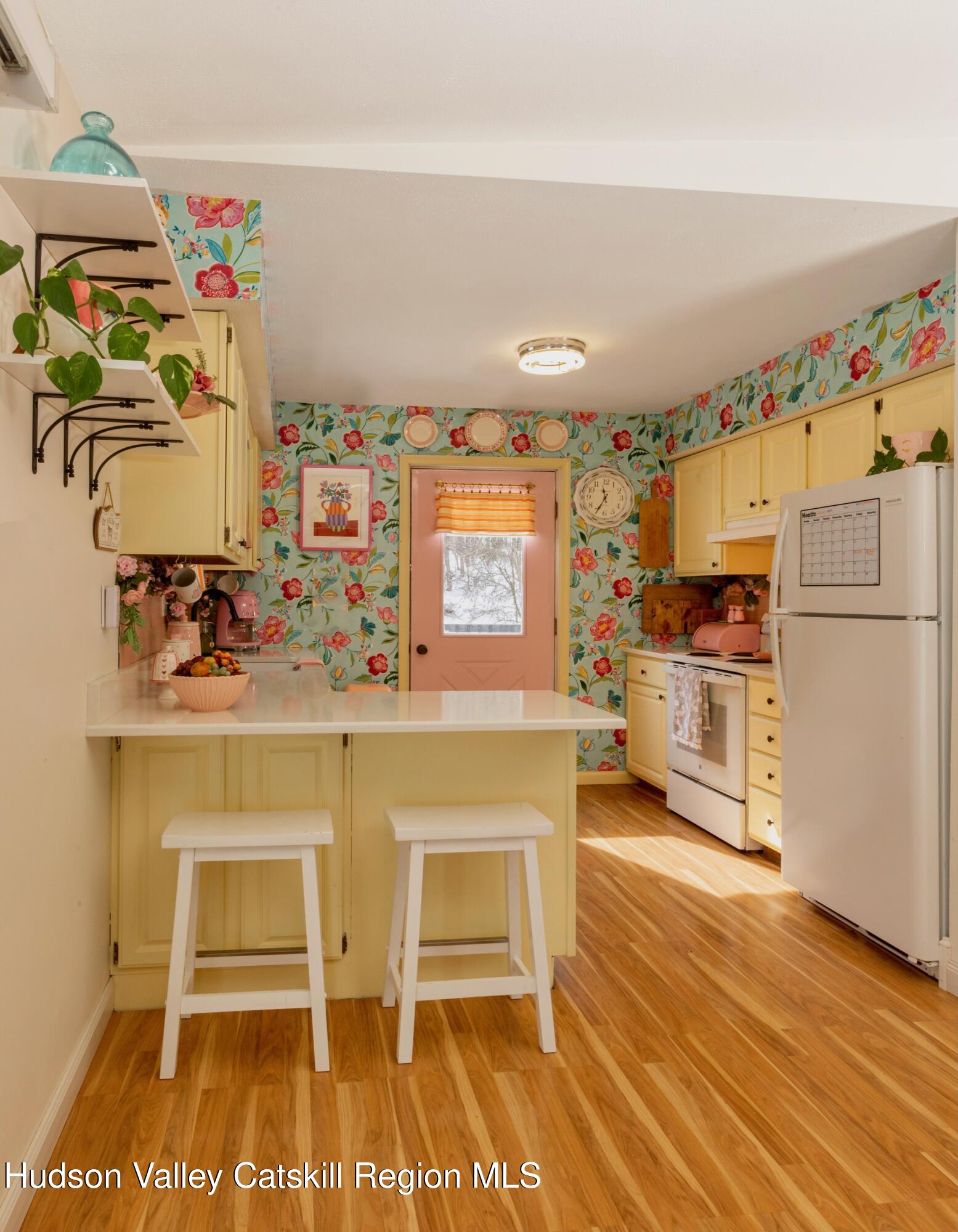 1046 Cow Hough Road New Paltz, NY 12561 - Photo 13 of 37 a kitchen with granite countertop a refrigerator and a stove top oven