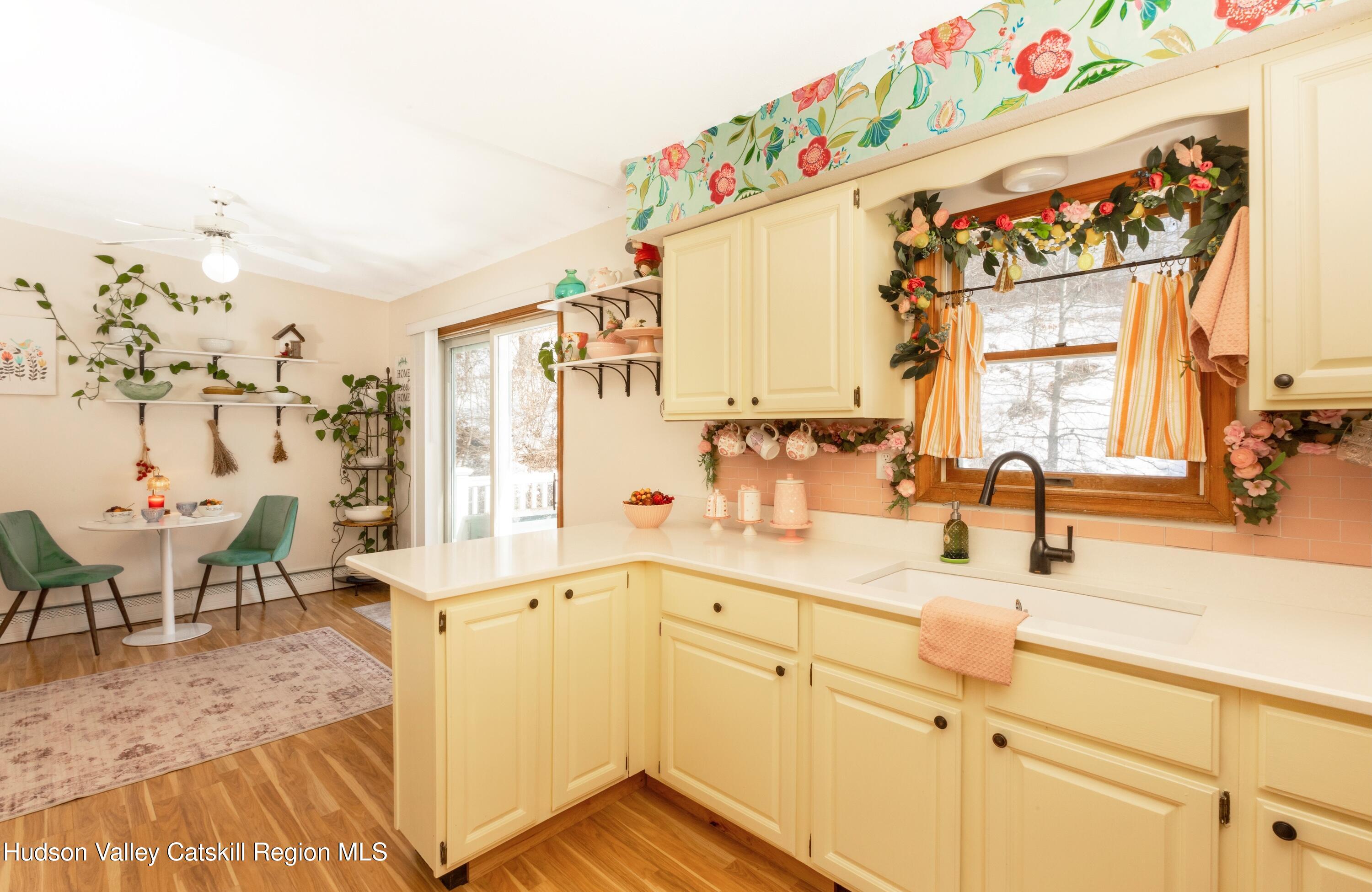 1046 Cow Hough Road New Paltz, NY 12561 - Photo 15 of 37 a kitchen with a sink cabinets and a window