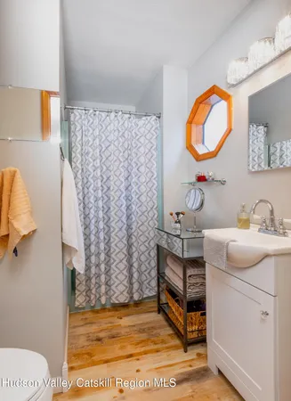 a room with a sink and a mirror