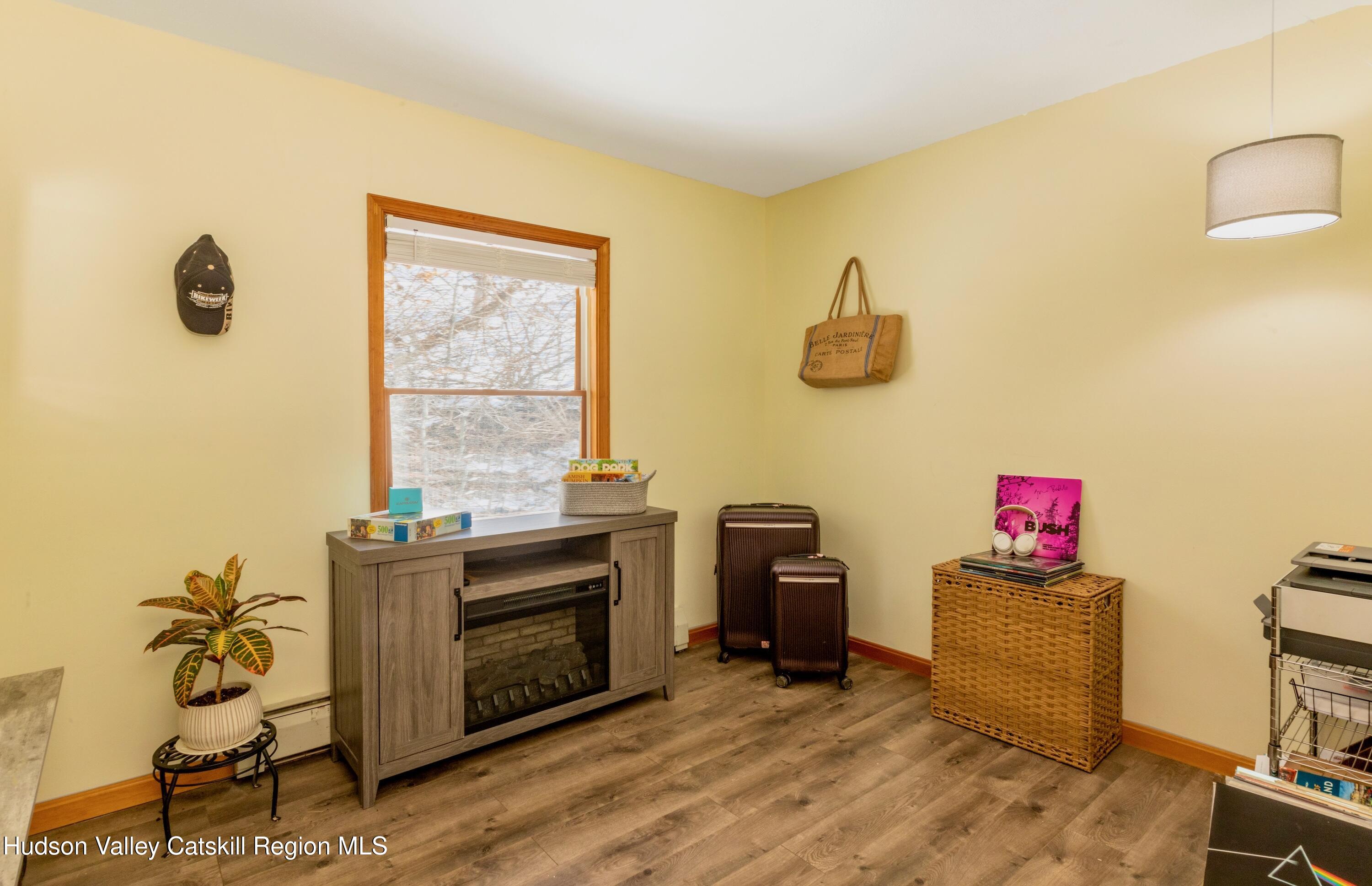 1046 Cow Hough Road New Paltz, NY 12561 - Photo 22 of 37 a living room with furniture and a window