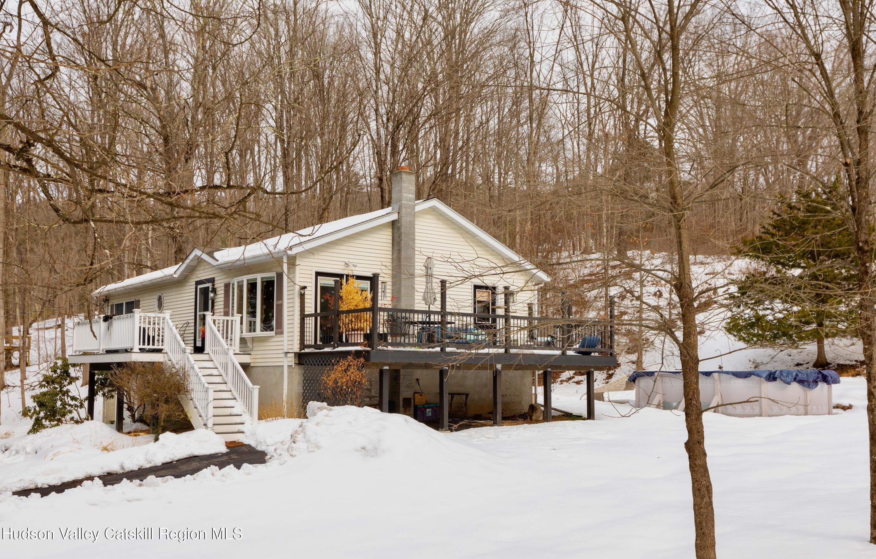 1046 Cow Hough Road New Paltz, NY 12561 - Photo 28 of 37 a view of a house with a yard covered in snow