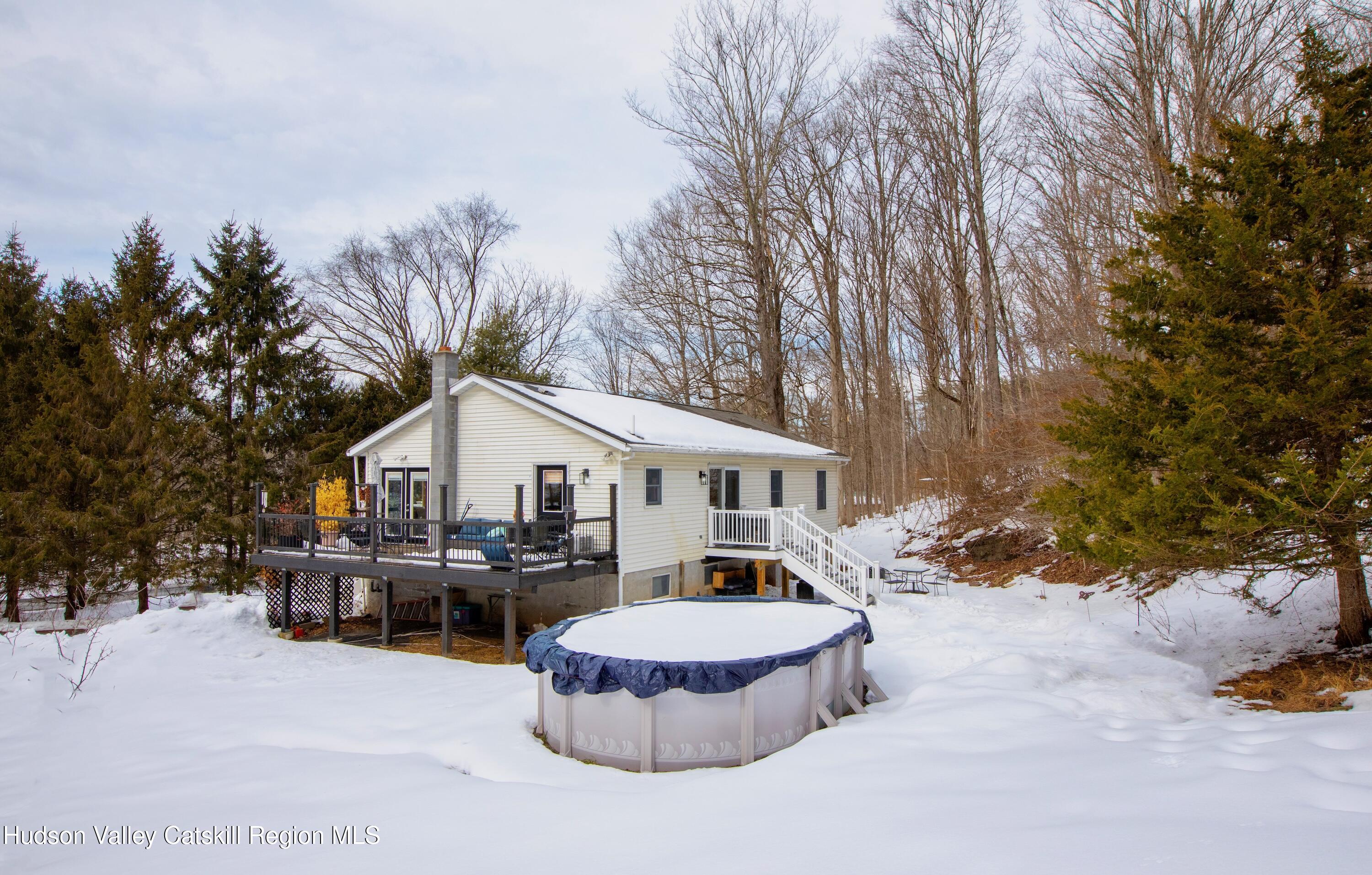 1046 Cow Hough Road New Paltz, NY 12561 - Photo 29 of 37 a front view of a house with a yard and trees