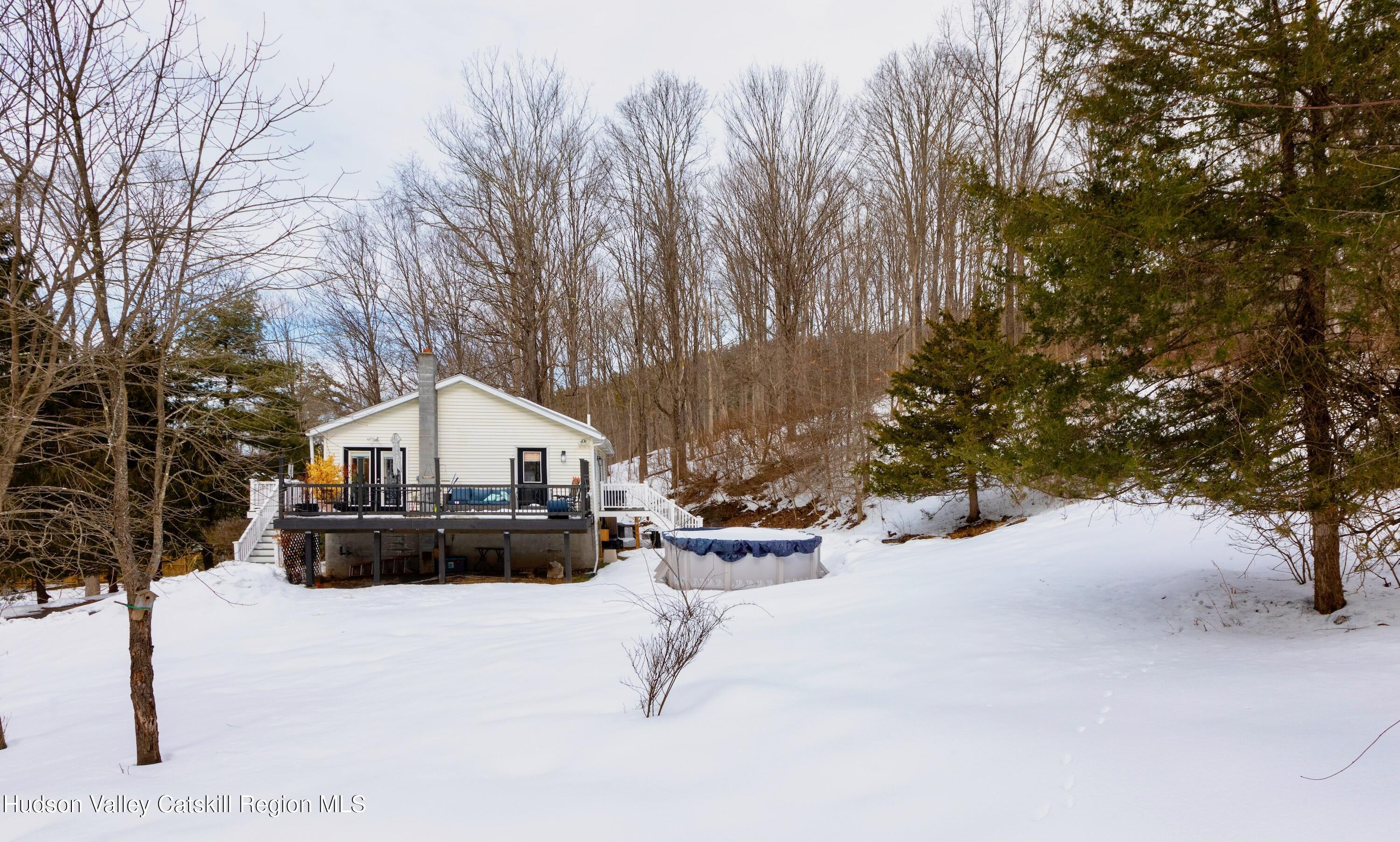 1046 Cow Hough Road New Paltz, NY 12561 - Photo 30 of 37 a view of a house with a yard covered in snow