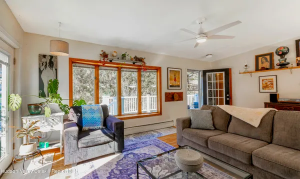 a living room with furniture and a large window