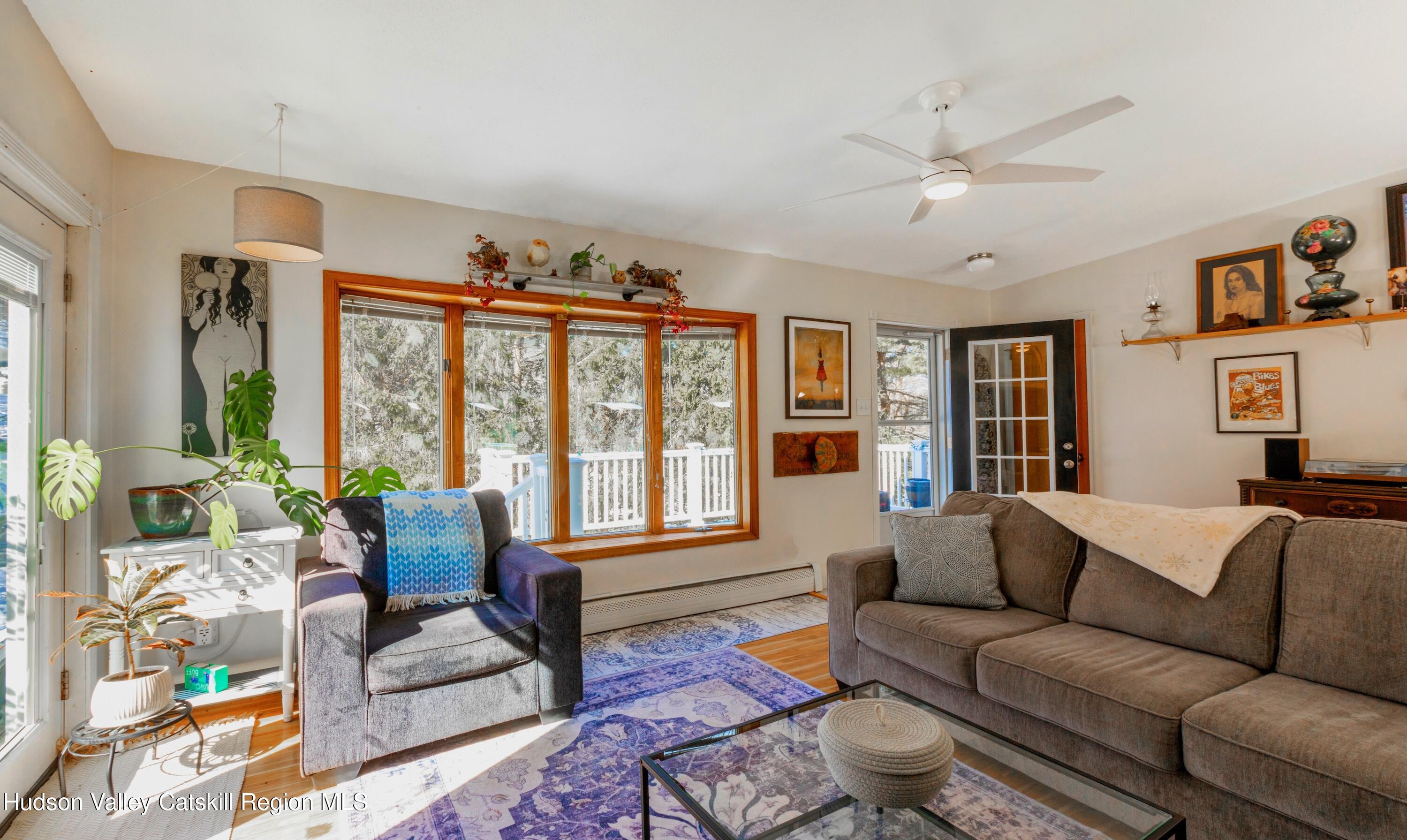 1046 Cow Hough Road New Paltz, NY 12561 - Photo 3 of 37 a living room with furniture and a large window