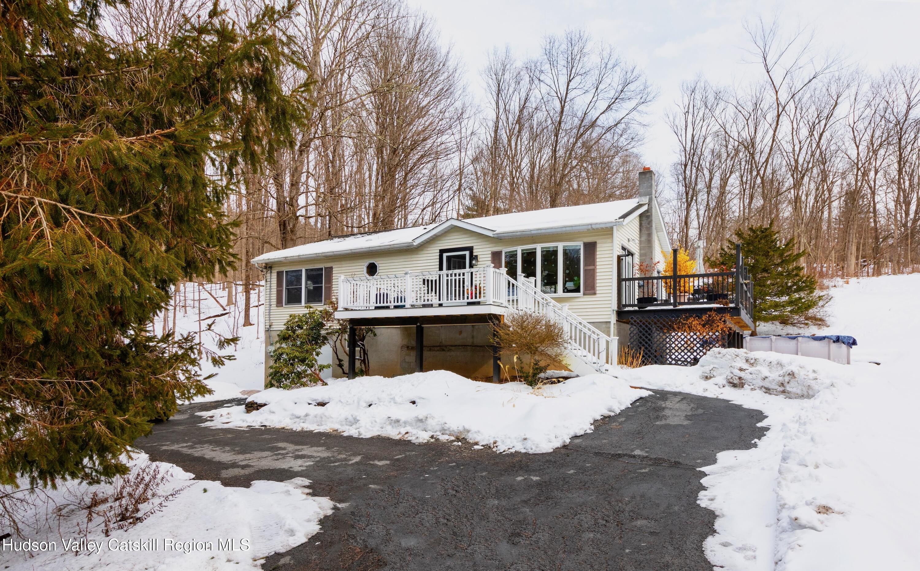 1046 Cow Hough Road New Paltz, NY 12561 - Photo 37 of 37 a view of a white house with a yard covered in snow