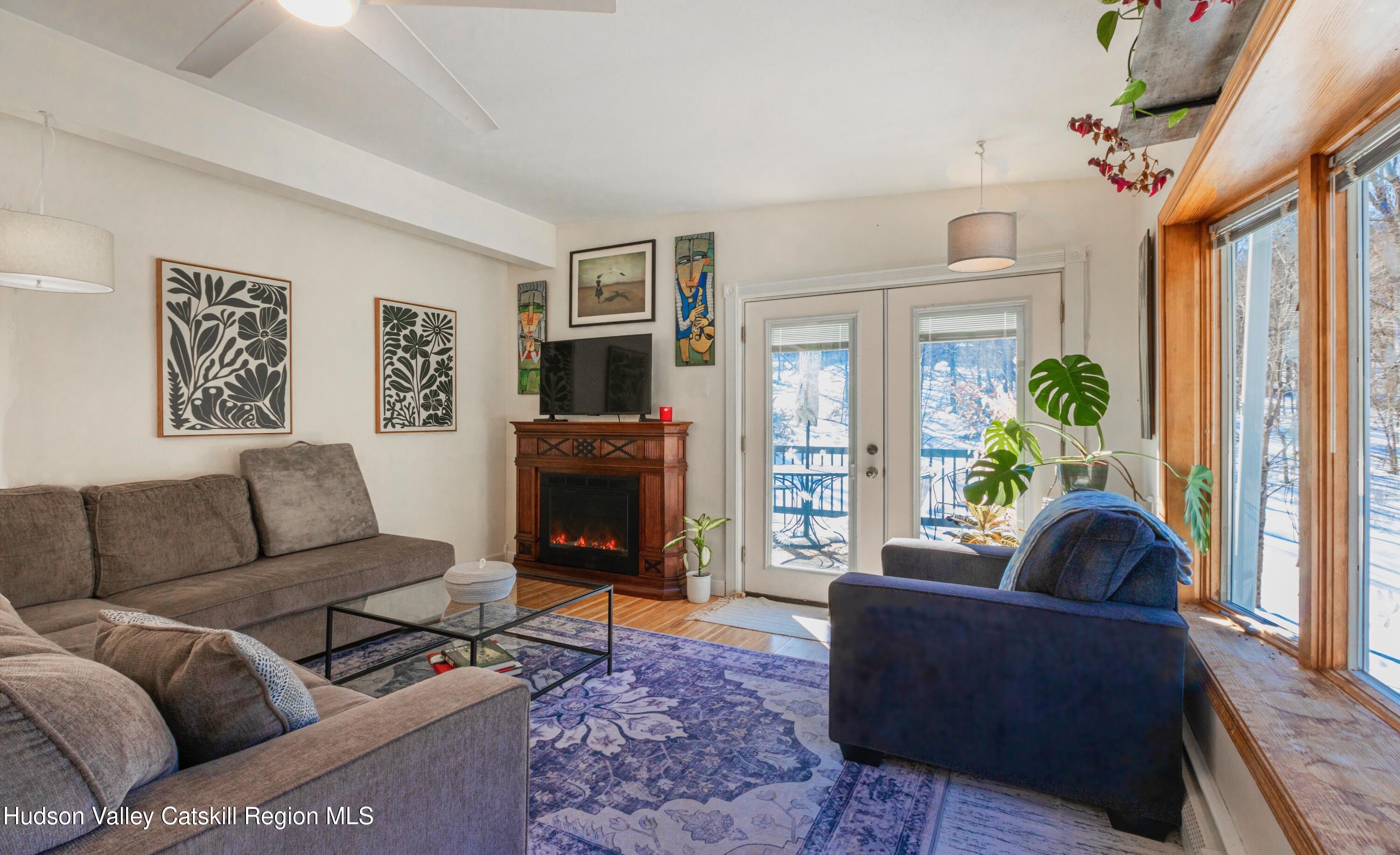 1046 Cow Hough Road New Paltz, NY 12561 - Photo 5 of 37 a living room with furniture and a fireplace