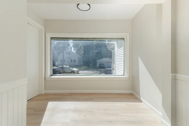 a view of a livingroom with a white umbrella