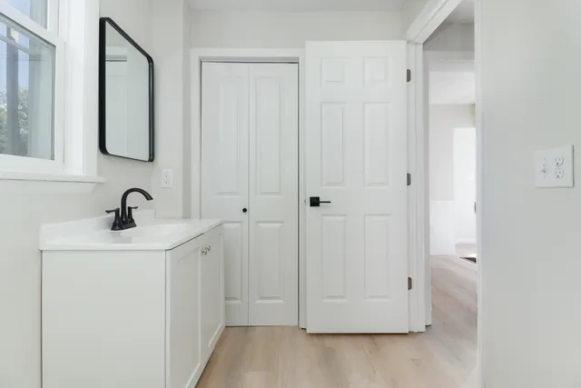 a bathroom with a sink and a mirror