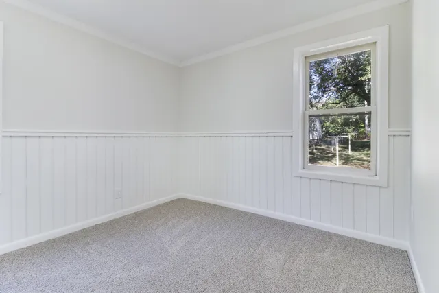 a view of empty room with windows