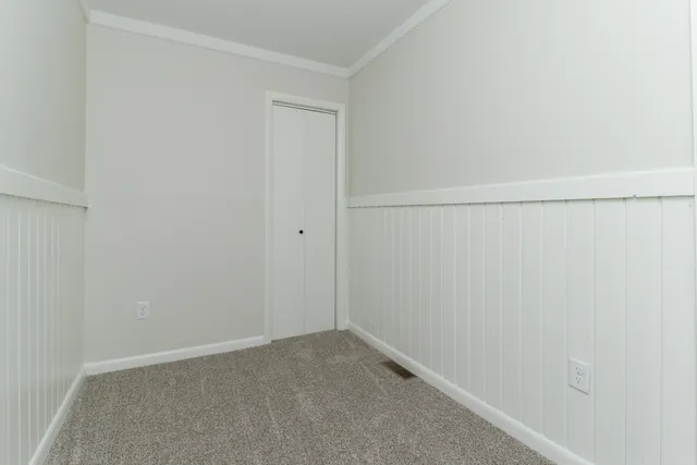 a view of a livingroom with an empty space and window