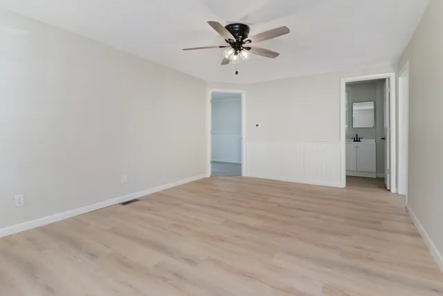 a view of a big room with wooden floor