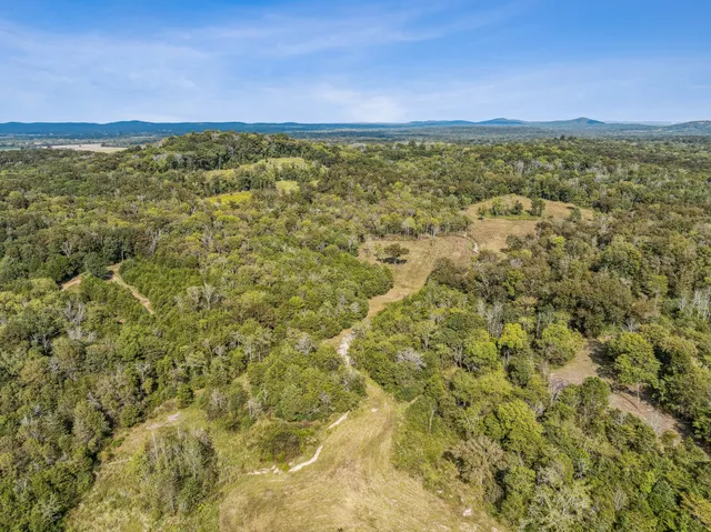 a view of a large yard with a large mountain view and mountain view
