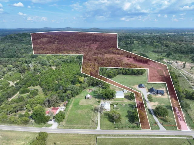 a view of a yard in front of a house with a small yard