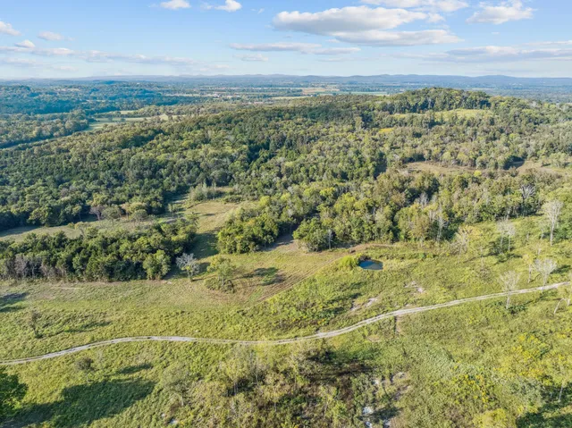 a view of a lake with mountains in background