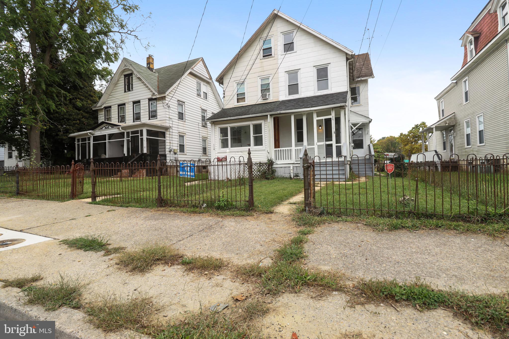 116 8th Street Salem, NJ 08079 - Photo 16 of 16 a view of a big house with a big yard and potted plants