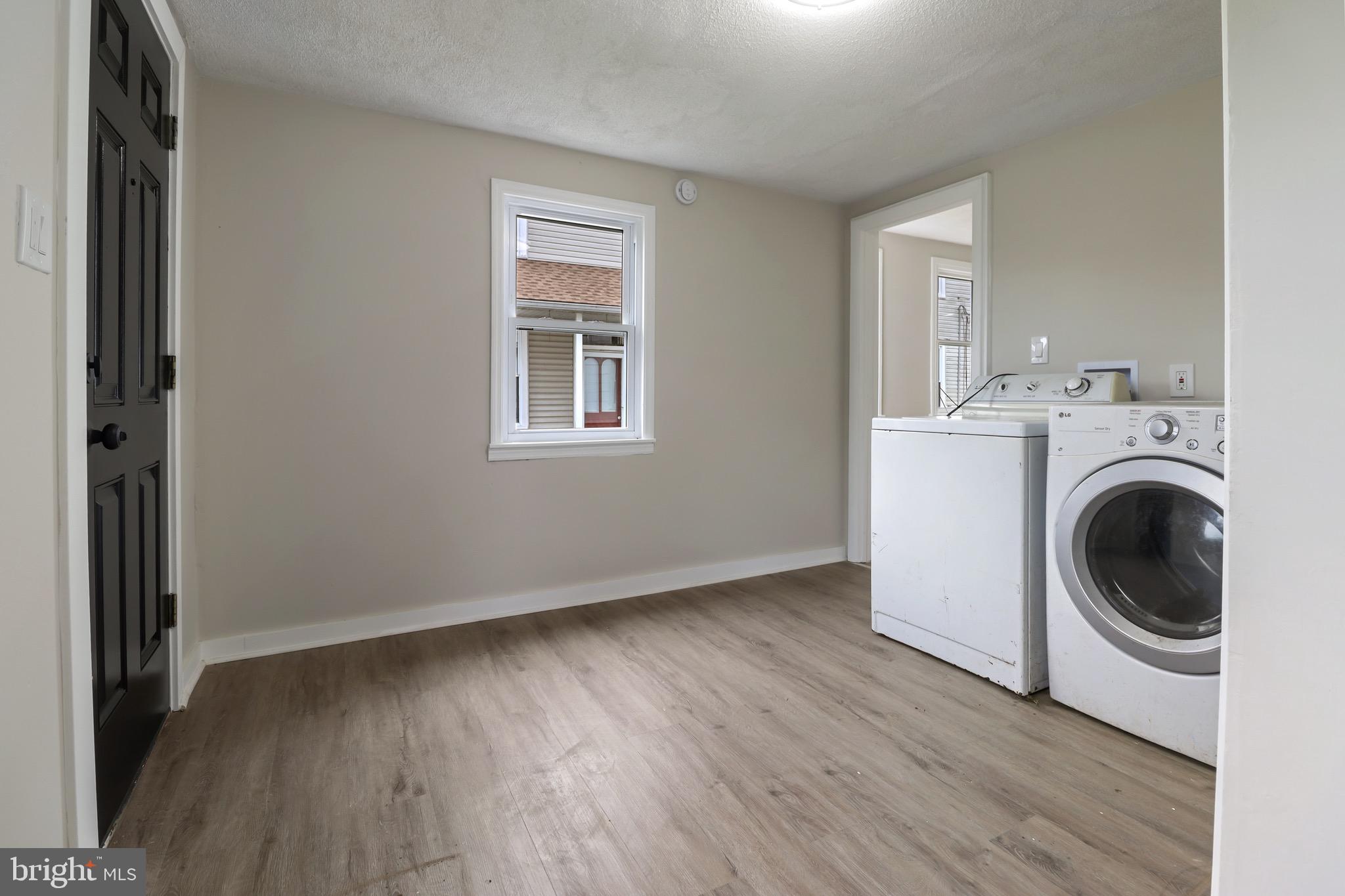 116 8th Street Salem, NJ 08079 - Photo 5 of 16 a view of a kitchen with washer and dryer