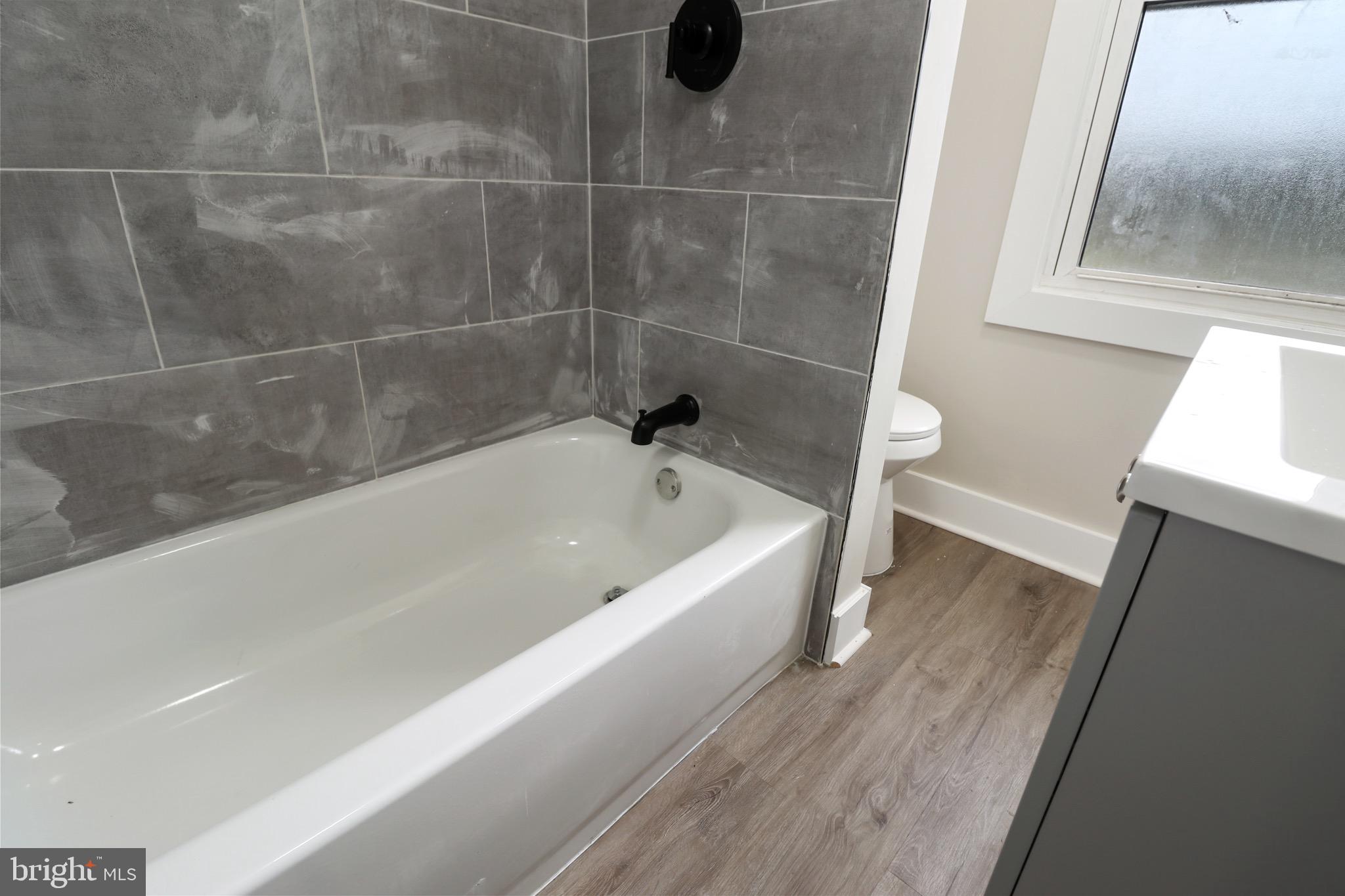 116 8th Street Salem, NJ 08079 - Photo 6 of 16 a bathroom with a bathtub