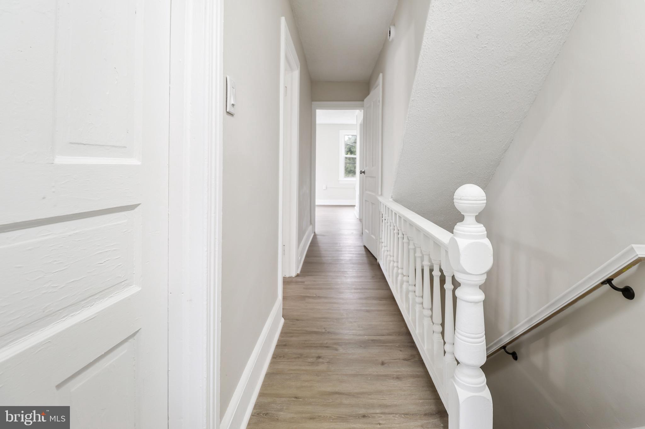 116 8th Street Salem, NJ 08079 - Photo 7 of 16 a view of a hallway with wooden floor